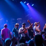 Chicago hip-hop artists performing live on stage showcasing their vibrant energy and connection with fans.